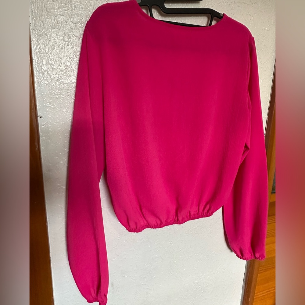pink long-sleeved shirt is size M